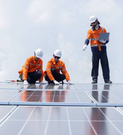 Three,Engineers,Checking,On,Solar,Panel,On,The,Rooftop